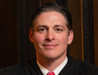 portrait photograph of Superior Court Judge Brandon Neuman